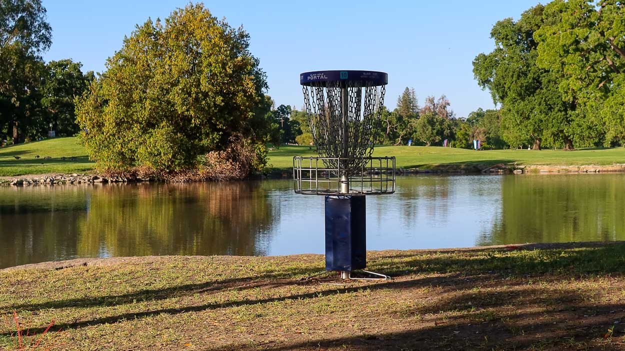 A photo of a disc golf basket